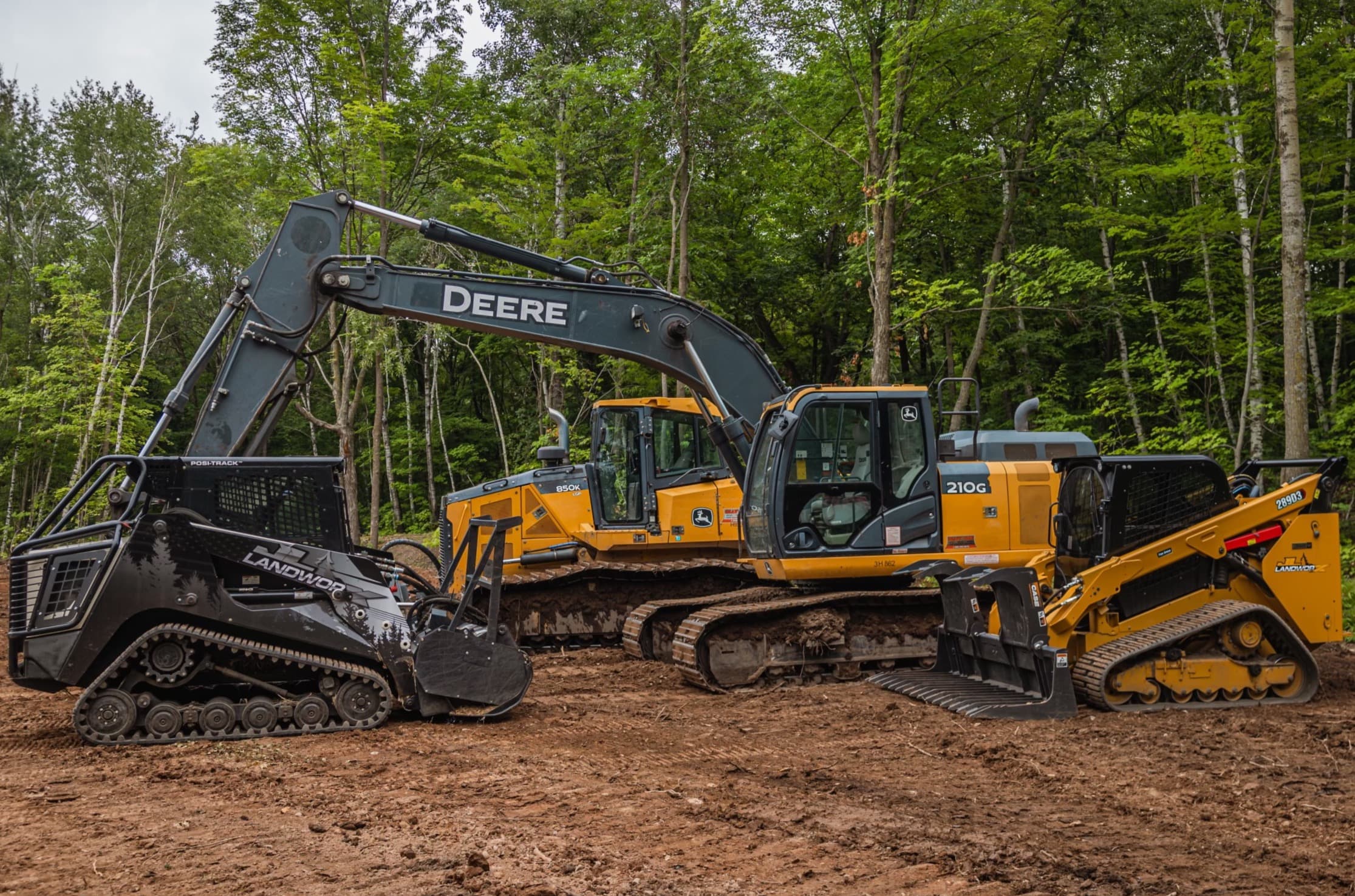 JL Landworx excavator, dozer, and compact track loaders on a dirt site
